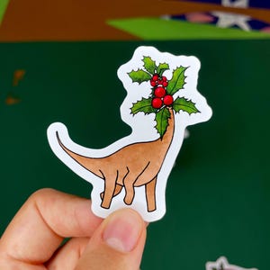 Dinosaur sticker with holly head , original for Christmas!