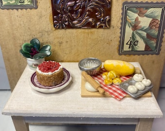 Miniature handmade decorative, with foraged, salvaged or reused items with a well and hedgehog