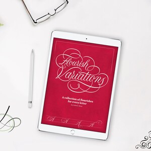 May include: A white tablet computer displaying a red background with the text "Flourish Variations" in white cursive script. The text below reads "A collection of flourishes for every letter by Robert Bess".