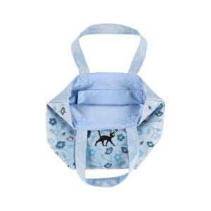 May include: A light blue tote bag with a black cat and floral design. The bag has two handles and a spacious interior.