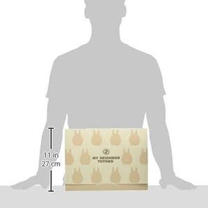 May include: A beige box with a repeating pattern of light brown Totoro characters. The box is 11 inches (27 cm) tall and features the text "MY NEIGHBOR TOTORO".
