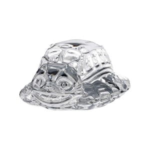May include: A clear glass turtle figurine with a smiling face and textured shell. The figurine has a wide base and is designed with detailed features, creating a whimsical and decorative piece.