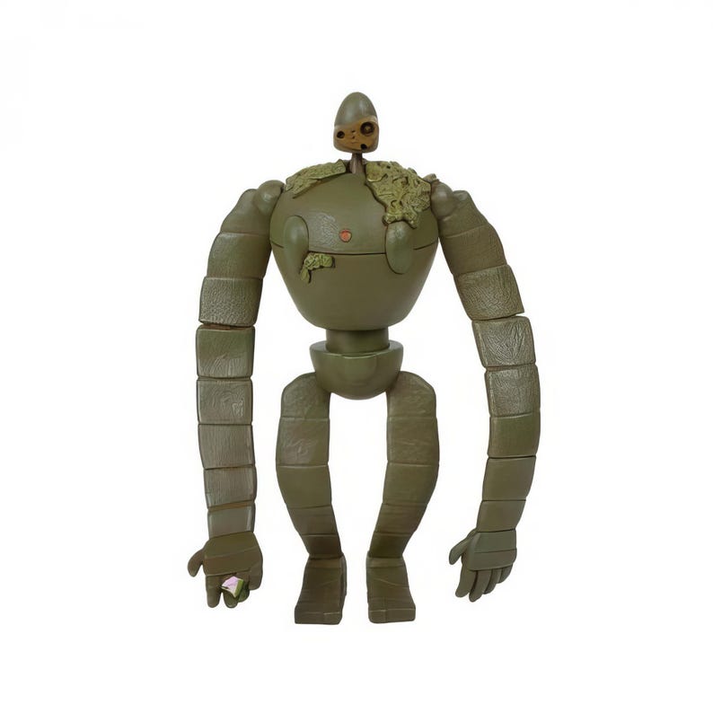 Peut inclure: Figurine de robot vert olive avec des membres segment&eacute;s et un torse bulbeux. La figurine a une petite t&ecirc;te et une touffe de feuillage sur l'&eacute;paule. Le robot tient une petite gemme rose dans sa main.