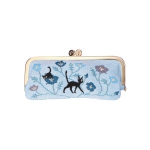 May include: A light blue fabric clutch with a gold metal frame and two gold metal clasps. The clutch features an embroidered design of black cats and blue flowers.