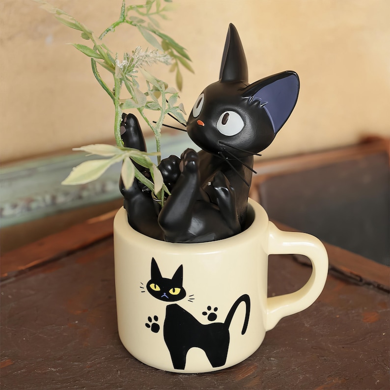 May include: A set of three ceramic mugs with a speckled, matte finish. The mugs are in shades of cream, light brown, and dark brown. Each mug has a simple, minimalist design, perfect for coffee or tea.