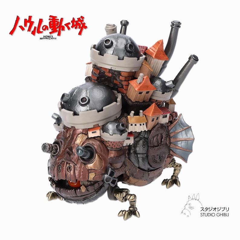 May include: A detailed figurine of Howl's Moving Castle, featuring a complex design with multiple levels, including turrets, chimneys, and small houses. The color palette includes shades of brown, gray, and orange. The Japanese text "ハウルの動く城" is visible.