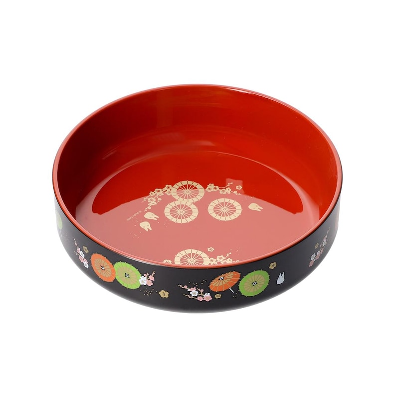 May include: A round, black and red Japanese lacquerware bowl. The interior is a glossy red, while the exterior is black with colorful floral and umbrella designs. The bowl's interior features gold circular patterns.