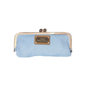 May include: A light blue denim clutch purse with a gold metal frame and a brown leather patch that reads "JIKIS Delivery Service".