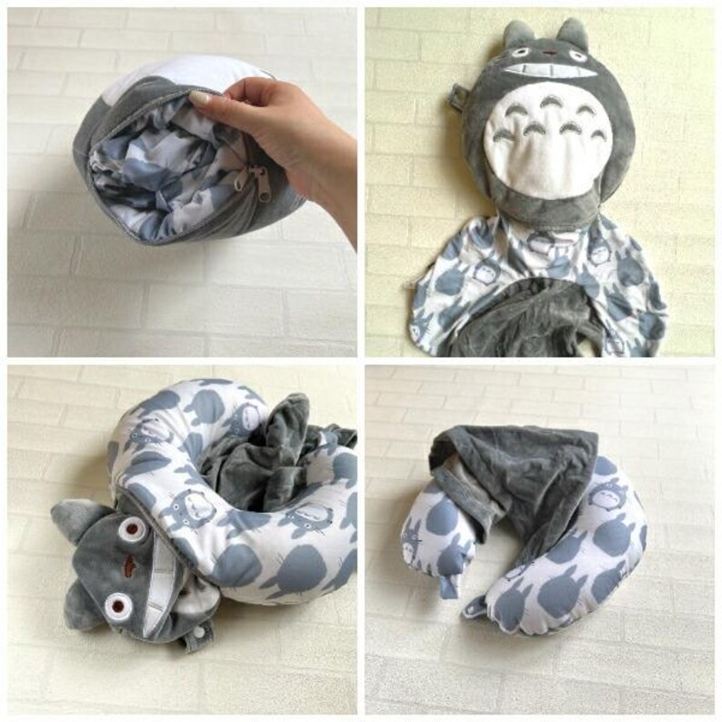 May include: A gray and white travel pillow featuring a cartoon character design. The pillow is gray with a white interior and a zipper closure. The pillow is designed to resemble a popular animated character. The pillow is shown in multiple configurations.