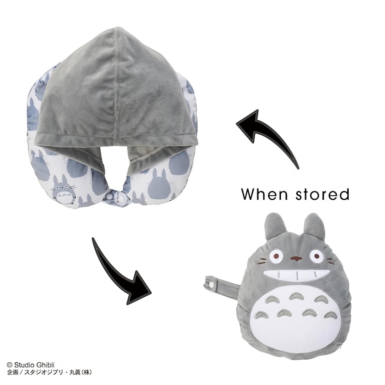 May include: A gray travel pillow with a hood, featuring a pattern of cartoon characters. The pillow transforms into a plush Totoro character when stored. The text "When stored" is also visible.