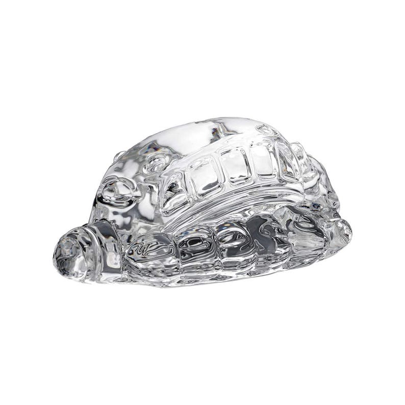 May include: A clear glass turtle figurine with detailed shell and head. The figurine is made of transparent glass, showcasing the intricate design of the turtle's shell and body. The turtle is a decorative item.