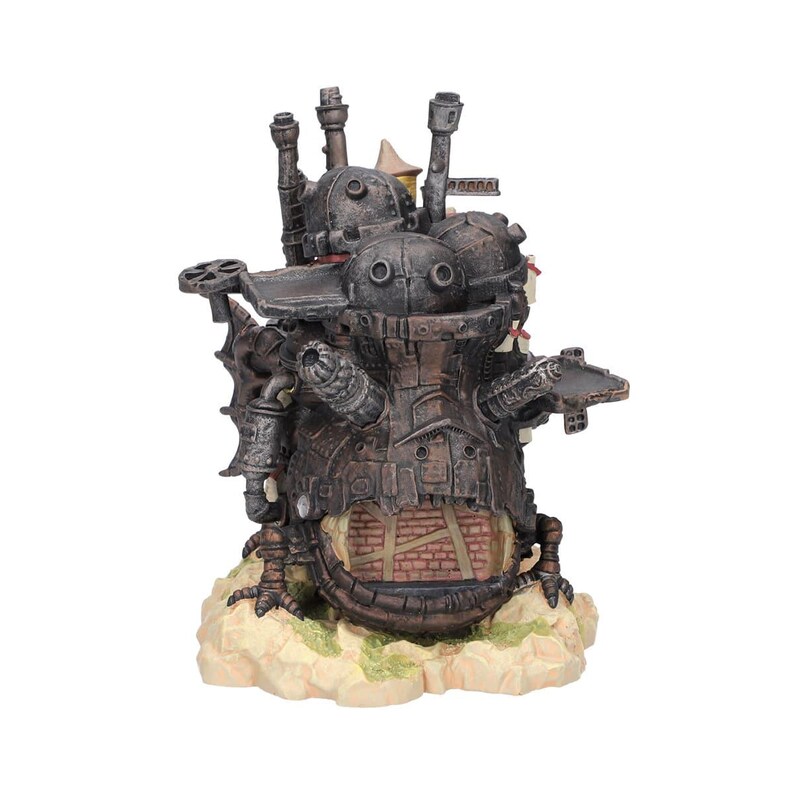 May include: A detailed, steampunk-style sculpture of a mechanical structure with multiple chimneys, gears, and a brick facade. The sculpture is primarily brown and gray, set on a beige base with hints of green.