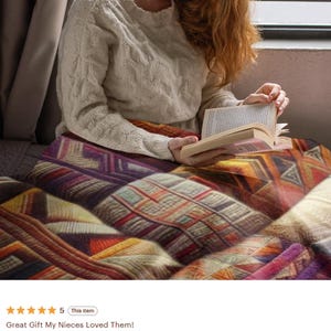 May include: A soft throw blanket featuring a vibrant, multi-colored geometric pattern with shades of deep purple, burnt orange, golden yellow, and cream. The blanket displays a repeating intricate design of triangles, squares, and lines.