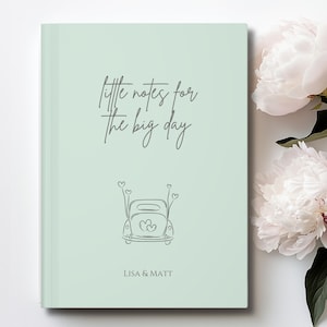 May include: A light green journal with the text "little notes for the big day" and a line drawing of a car with hearts. The names "Lisa & Matt" are printed at the bottom.