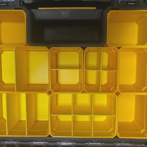 May include: Open black and yellow tool organiser with multiple compartments. The interior features various sized yellow bins and dividers for organising tools and hardware. The organiser is designed for efficient storage and easy access.