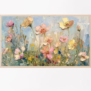 May include: An oil painting of a field of flowers in a wooden frame. The flowers are in shades of pink, yellow, and peach, with green stems and leaves. The background is a light blue, and the painting has a textured, impressionistic style.