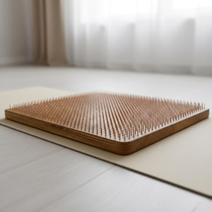 A wooden yoga mat with a textured surface, placed on a white floor.