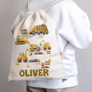 May include: A yellow drawstring backpack with a construction theme. The backpack features a variety of construction vehicles, including a dump truck, excavator, bulldozer, and a backhoe. The backpack also has a yellow and black striped border and the name "OLIVER" printed in black letters.