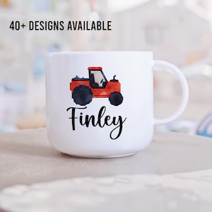 May include: White ceramic mug featuring a red and black tractor design with the name "Finley" printed in black. The mug has a handle and is suitable for children.