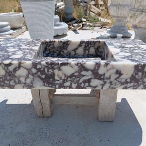 wall-mounted natural Calacatta violet marble sink
