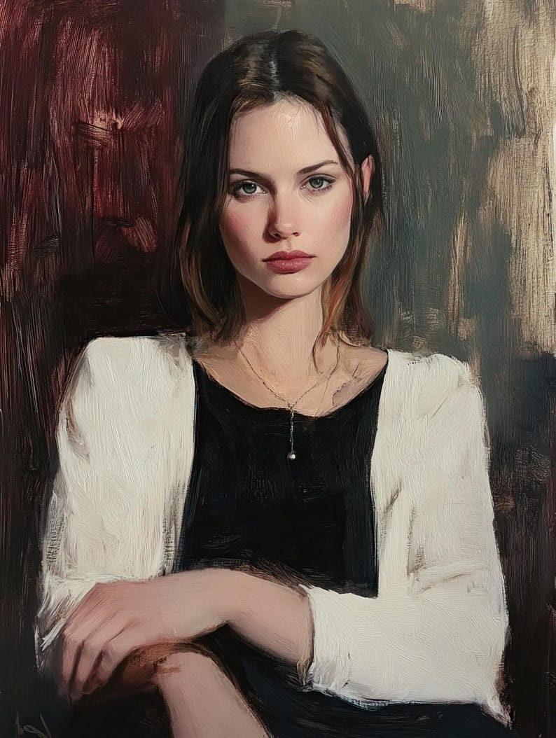 May include: A woman with long brown hair wearing a white cardigan over a black top and a silver necklace with a pearl pendant. She is looking directly at the viewer with a serious expression.