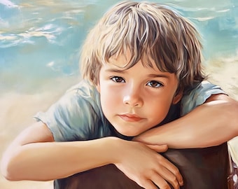 May include: A young boy with light brown hair and blue eyes is looking at the camera. He is wearing a light blue t-shirt and is resting his chin on his hand. The background is a blurred image of a beach.