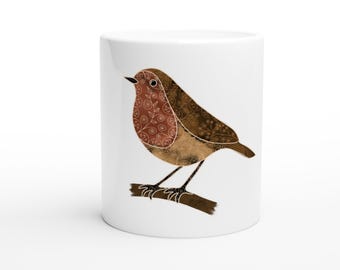 May include: White ceramic mug featuring a detailed illustration of a robin bird perched on a branch. The bird has brown and reddish-brown patterned feathers. The mug is a standard size and shape.