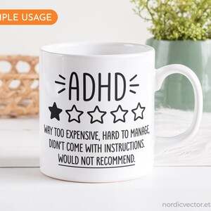 May include: White ceramic mug with a black graphic that reads "ADHD" with a one-star rating and the text "Way too expensive, hard to manage, didn't come with instructions. Would not recommend."