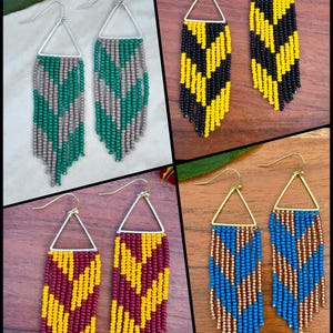 May include: Four pairs of triangular drop earrings featuring beaded fringe in chevron patterns. The sets include green and gray, black and yellow, maroon and yellow, and blue and metallic gold beads, all suspended from metal ear wires.