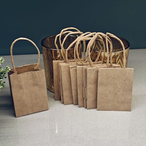 thumbnail interactive-video image 1 of 10 Pack Brown Square Gift Bags - 8x8x8 Inches, Kraft Paper With Handles, Reusable 1 of 5