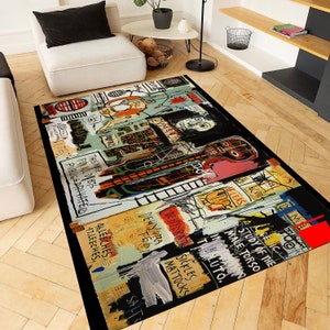May include: A colorful rug with a black background featuring abstract art with bold black lines and colorful shapes. The rug has text in white, black, and yellow, including "This Nite", "For All Debts", "Public", "Fleas", "Study of the Male Torso", "Dehydrate", "Sickles", "Mattocks", and "Salt".