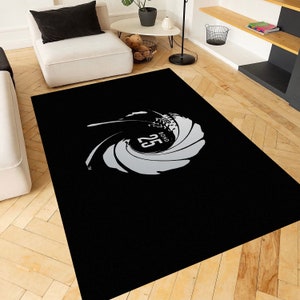 Peut inclure: Tapis noir et blanc avec un logo James Bond 25. Le logo est un tourbillon stylisé avec les mots "Bond 25" à l'intérieur.