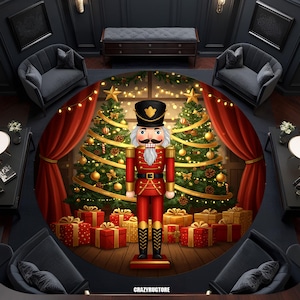 May include: A round Christmas-themed rug featuring a large nutcracker in a red uniform, standing in front of two decorated Christmas trees. The trees are adorned with ornaments and lights. Red wrapped gifts are at the base of the trees. The rug has a dark background.