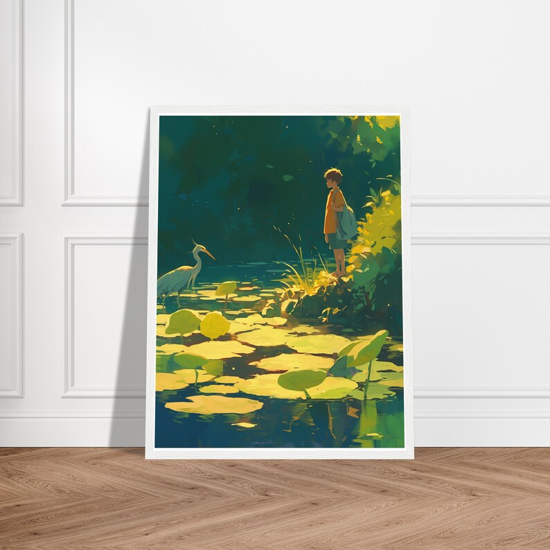 May include: A framed art print depicts a serene waterscape with a young person standing near the water's edge. The artwork features a heron, lily pads, and a lush green background. The color palette includes shades of yellow, green, and blue.