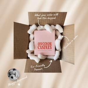 May include: A cardboard box filled with white packing peanuts surrounds a pink box of "OFFCOLOR CANDLES." The box is labeled "What your order will look like shipped." A small image of a dog is labeled "Maggie Approved."