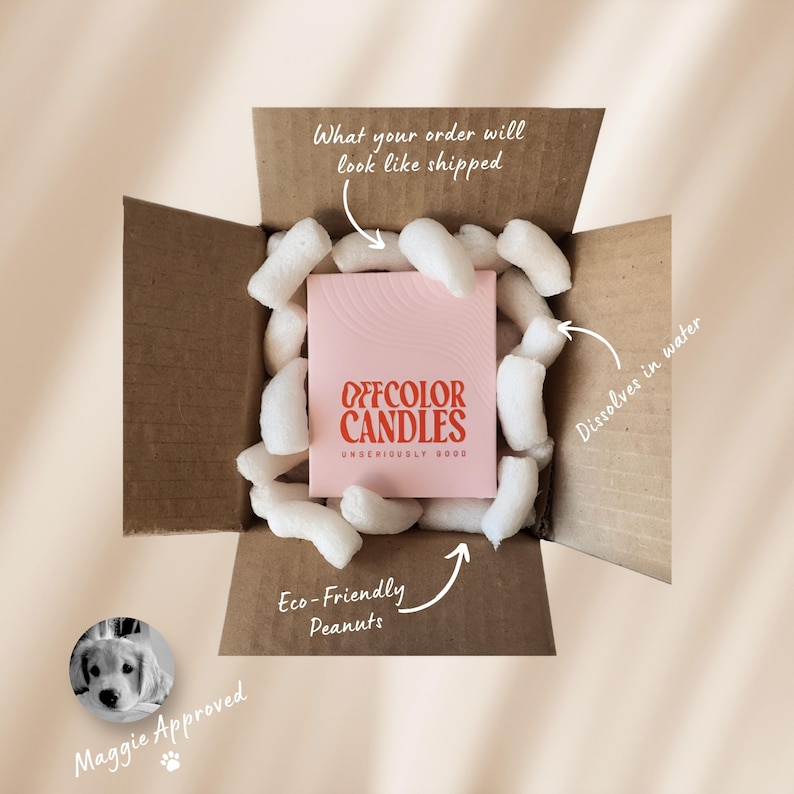 May include: A cardboard box filled with white packing peanuts surrounds a pink box of "OFFCOLOR CANDLES." The box is labeled "What your order will look like shipped." A small image of a dog is labeled "Maggie Approved."