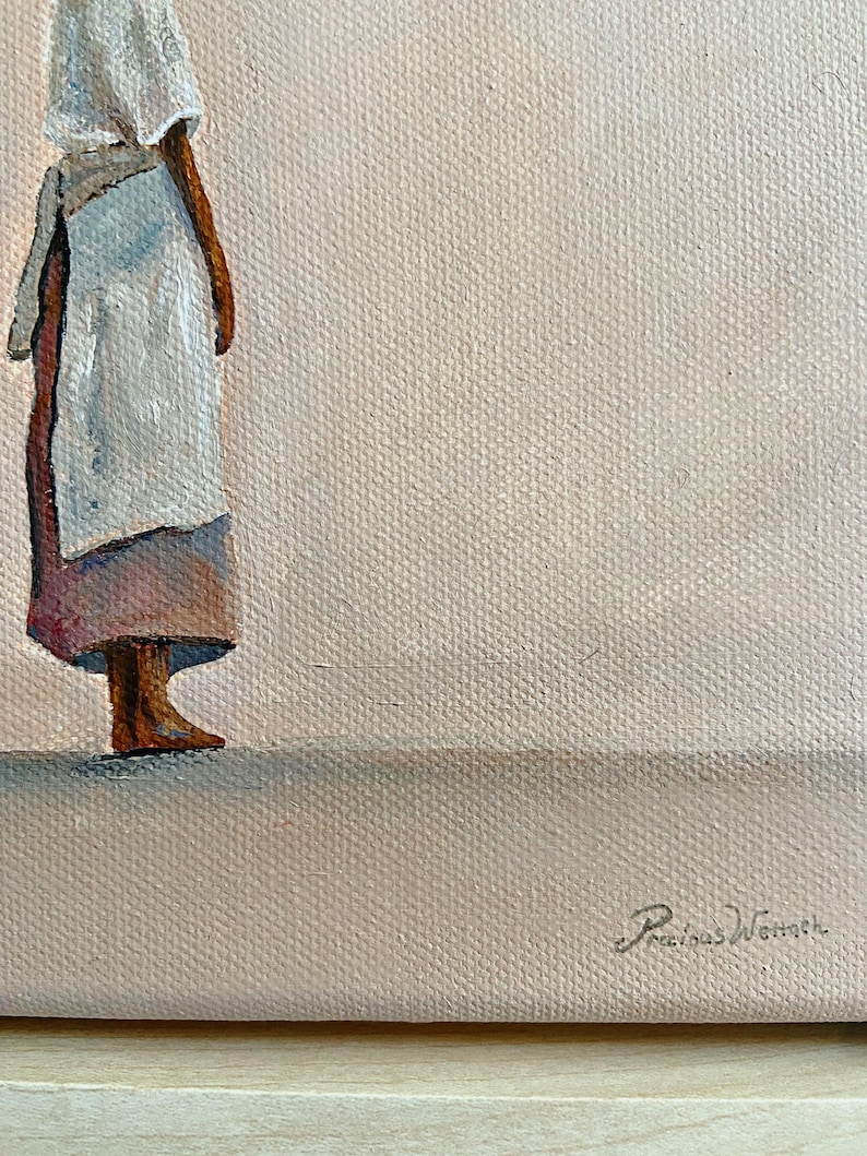 May include: An oil painting depicts a figure in a white head covering and apron, standing against a light pink background. The figure's legs are visible, with a skirt in shades of pink and brown. The artist's signature is in the lower right corner.