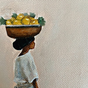 May include: An oil painting depicts a person carrying a bowl of yellow fruit on their head. The person is wearing a white top and a dark bun. The background is a light pink color.