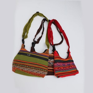May include: Three colorful crossbody bags with woven patterns. The bags feature a variety of colors, including green, red, and brown, with striped and geometric designs. Each bag has a zippered top and an adjustable strap.