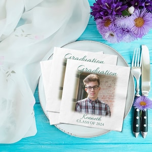 May include: White napkins with a teal graduation design and a photo of a young man wearing glasses. The text reads "Graduation" and "Kenneth CLASS OF 2024".