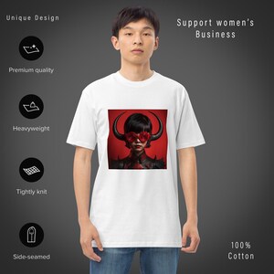 May include: White t-shirt with a graphic print of a woman wearing red sunglasses and horns. The text "Support women's Business" is printed on the top right corner of the image.