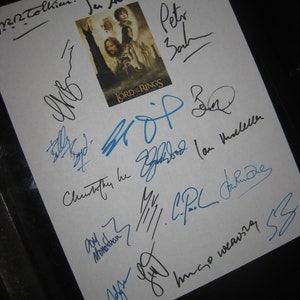May include: A white sheet of paper with multiple signatures in black ink. The signatures include "J.R.R. Tolkien", "Sean Astin", "Chad Bowen", "Peter Jackson", and "Ian McKellen". The signatures are from the cast and crew of the Lord of the Rings movie trilogy.