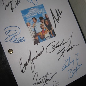 May include: A white sheet of paper with the Home Improvement logo and cast photo, covered in signatures in black and blue ink. The paper is held together with two brass fasteners.