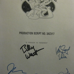 May include: A production script for the animated series Futurama, featuring the show's logo and character illustrations. The script is signed by several individuals, including Billy West and Katey Sagal.