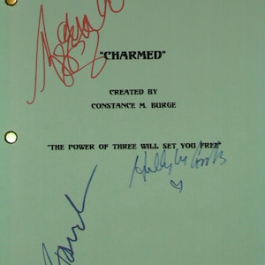 May include: A teal script featuring the title "CHARMED" and the phrase "THE POWER OF THREE WILL SET YOU FREE." The script is signed in red and blue ink. The text "CREATED BY CONSTANCE M. BURGE" is also visible.
