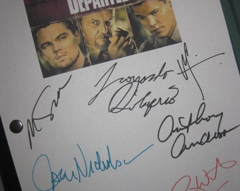 May include: A white sheet of paper with black and blue signatures from the cast of the movie "The Departed." The signatures include: Martin Sheen, Jack Nicholson, Leonardo DiCaprio, Mark Wahlberg, and Anthony Anderson. The movie poster for "The Departed" is in the upper right corner of the page.
