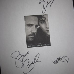 May include: A black and white print of the film "Beautiful Boy" featuring Steve Carell and Timothée Chalamet. The print is signed by Steve Carell, Timothée Chalamet, and other individuals.