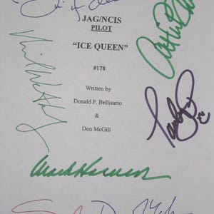 May include: A white paper with multiple signatures in various colors. Text includes "JAG/NCIS PILOT", "ICE QUEEN", and the names Donald P. Bellisario and Don McGill. The signatures are in blue, green, purple, and red ink.