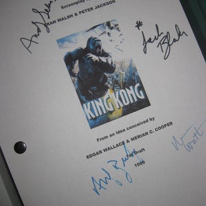May include: A white screenplay titled "King Kong" with multiple signatures. The cover features a movie poster image of King Kong. The screenplay is by Fran Walsh & Peter Jackson, and the idea was conceived by Edgar Wallace & Merian C. Cooper.