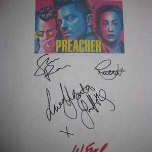 May include: A promotional image for the television show "Preacher" featuring a colorful graphic of the show's stars and the show's title. The image is covered in signatures in black ink, with one signature in red ink.